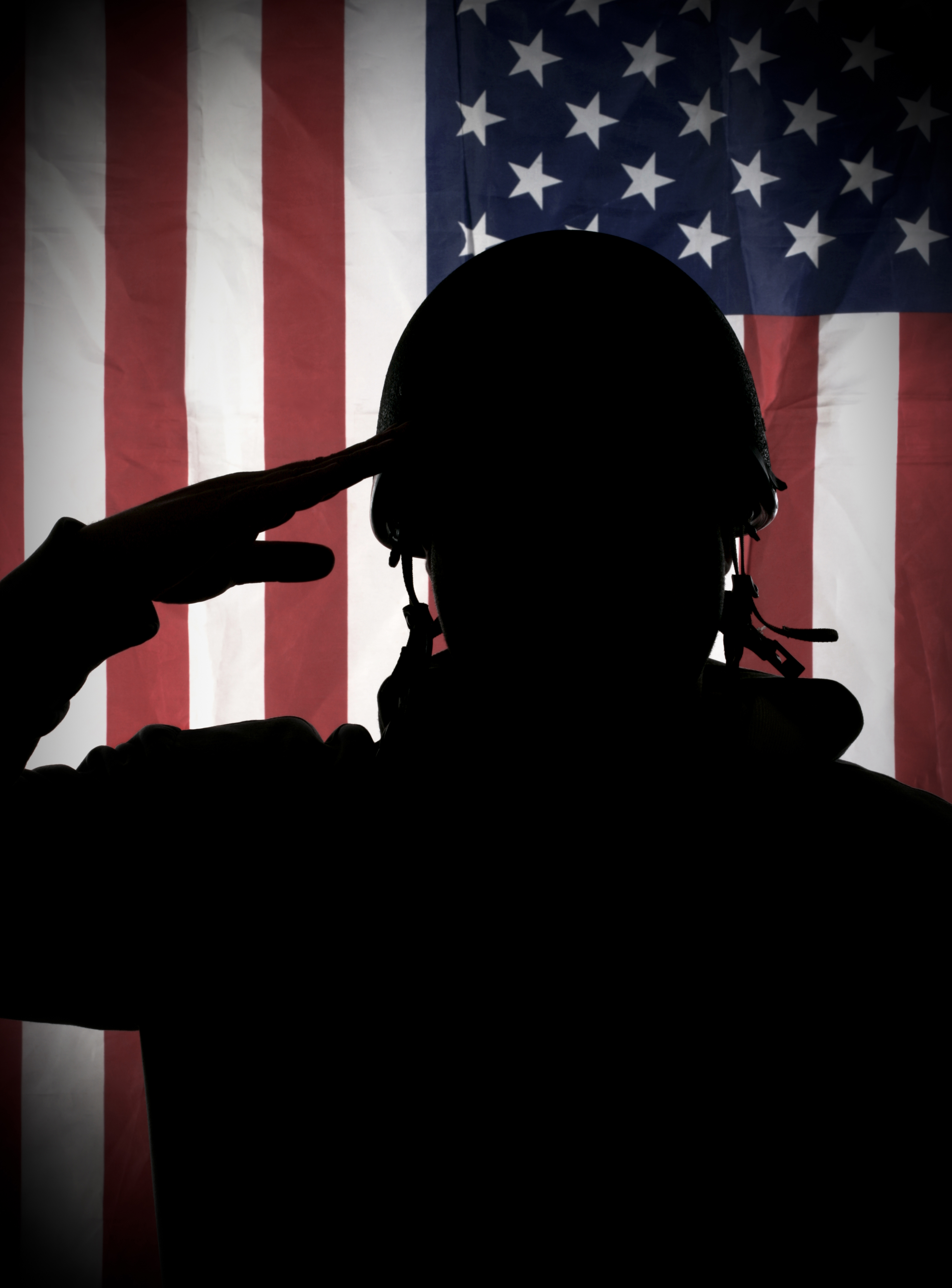 Soldier saluting at the American flag