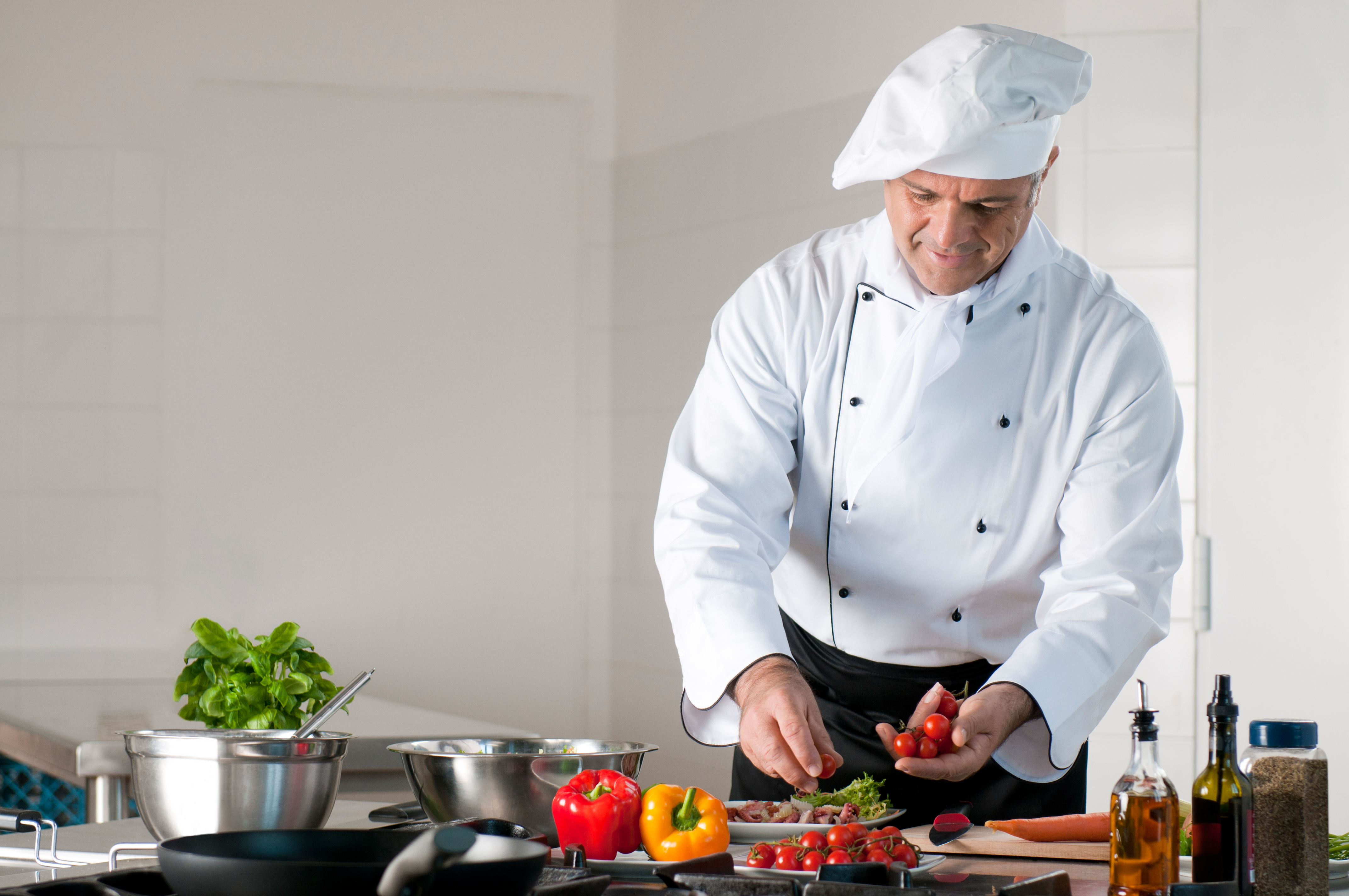 Older chef preparing a meal